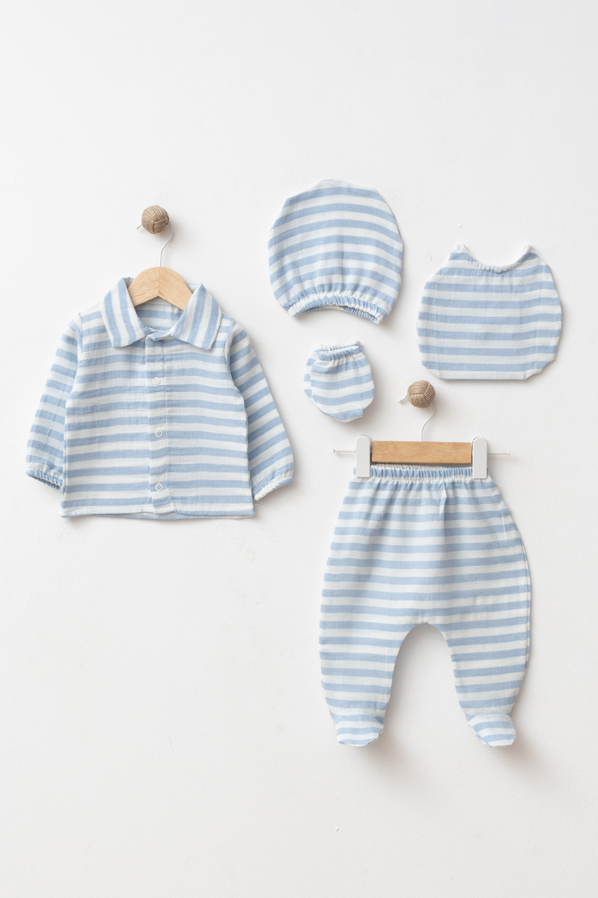 Wholesale 5-piece GOTS certified cotton baby boy hospital set with button-front top, footed trousers, hat, mittens and matching bib.