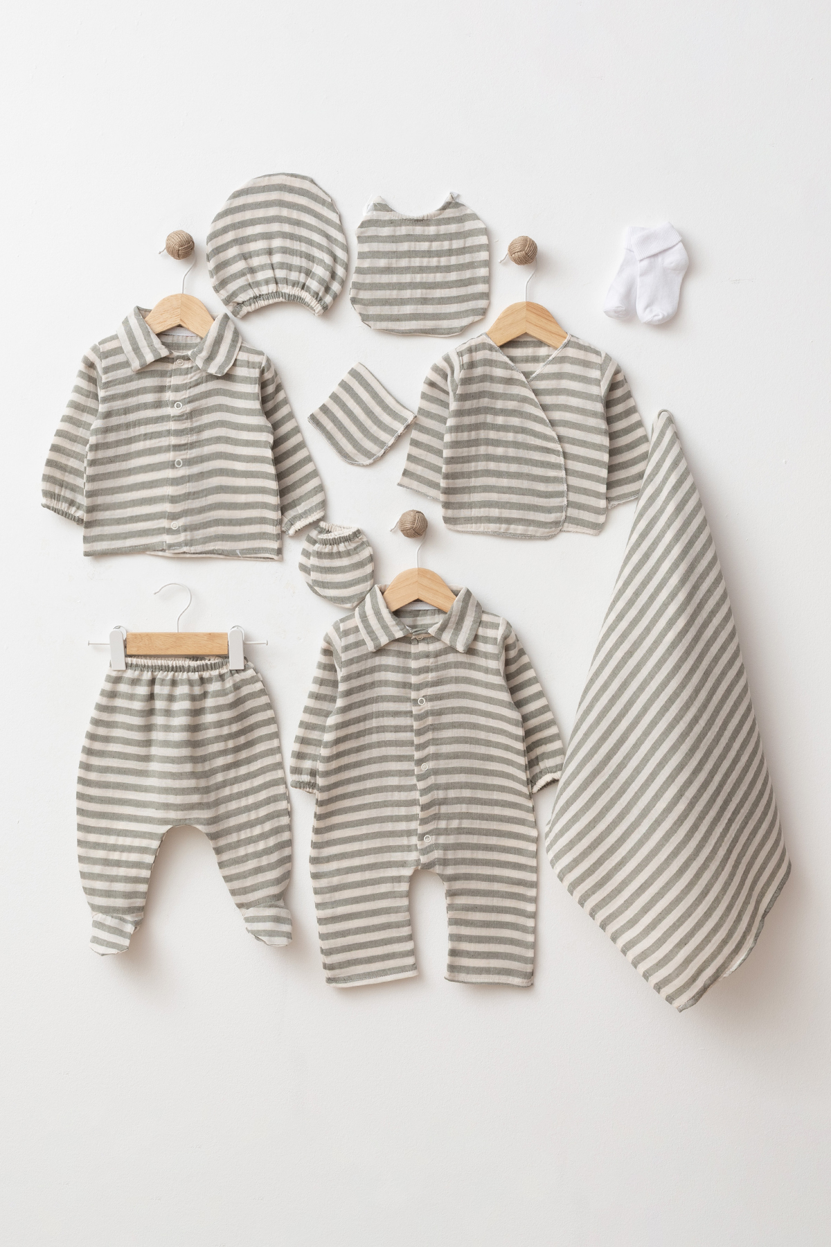 Wholesale 10-piece GOTS-certified cotton newborn baby boy hospital set with matching romper, tops, footed trousers, blanket, hat, bib, mittens and socks.